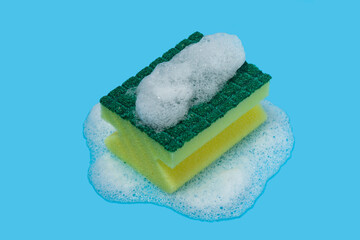 dishwashing sponge with foam on color background