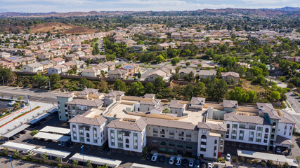 Daytime aerial view of a high density suburban neighborhood in Riverside, California, USA.