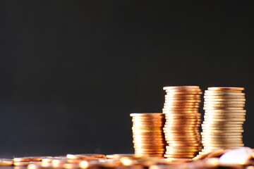 stack of coin on table background and business or finance saving money