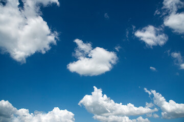 Blue sky fluffy white clouds on summer season bright clear skyline with beautiful cloudscape. Panorama blue sky clouds pattern on daylight with copy space. Cumulus cloudscape air climate sunny day