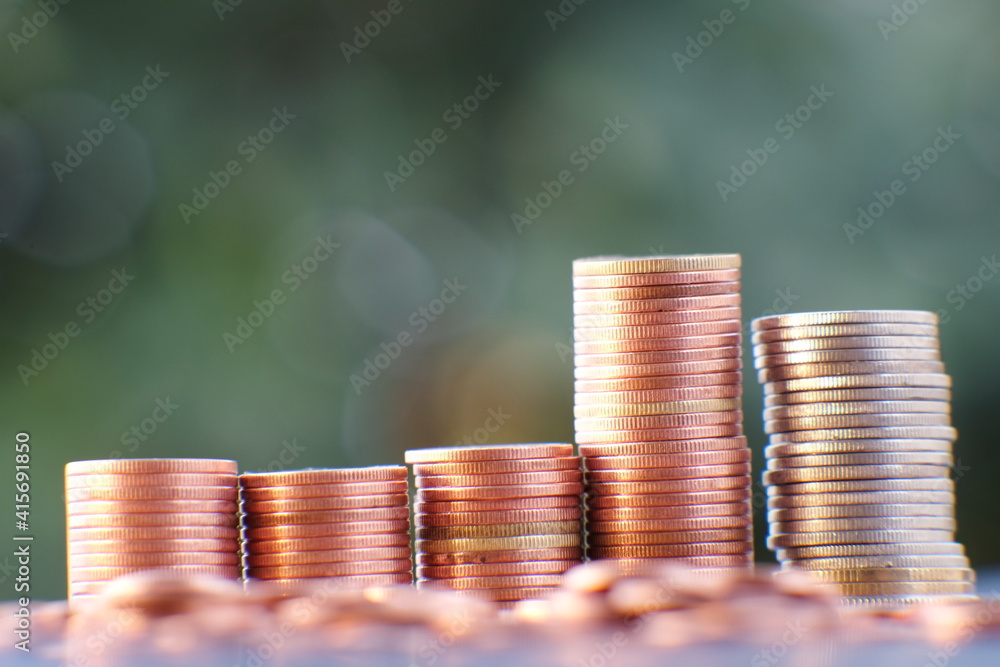 Wall mural stack of coin on table background and business or finance saving money