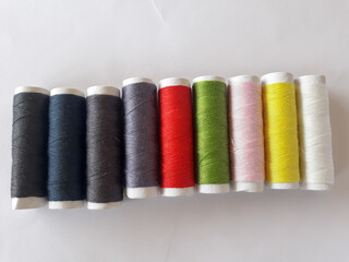 Rows of sewing threads of various colors