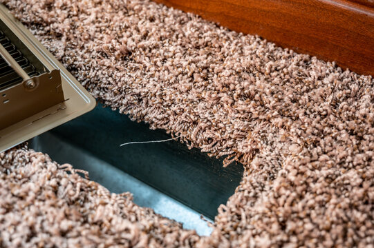 carpeted open floor vent with cover removed