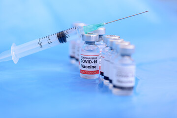 Vaccine and Healthcare Medical concept. Vaccines and syringe on blue background for prevention,immunization and treatment from corona virus infection