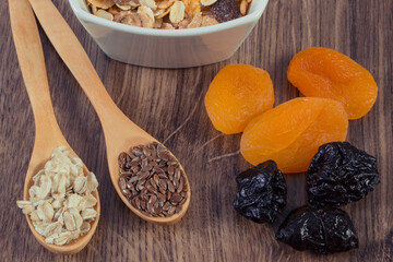 Linseed, oat bran, dried fruits and muesli. Healthy food containing minerals and fiber. Increase metabolism