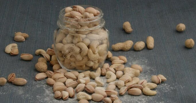 Different types of nuts, nuts in honey, nuts in slowmo, honey