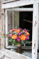 bouquet of flowers on the background of an old vintage window