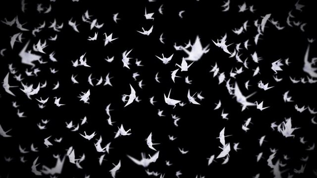 Flying many white origami cranes on black background. Beautiful origami floating in air. Peace concept. 3D loop animation of paper.