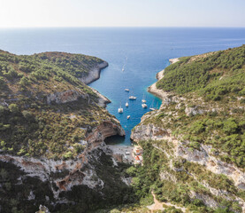 Aerial drone shot of iconic Stiniva cove beach of Adriatic sea on Vis Island in Croatia summer