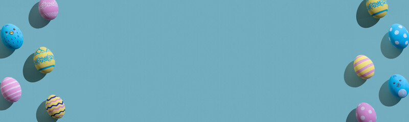 Easter background. Festive frame. Holiday symbol ornament. Gift card. Colorful painted eggs with cute chicken rabbit faces polka dot stripes waves pattern isolated on blue copy space.