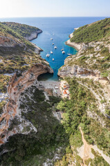 Aerial drone shot of iconic Stiniva cove beach of Adriatic sea on Vis Island in Croatia summer
