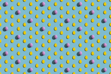 Colorful abstract background. Seamless pattern. Decorative design for kids. Contrast pink polka dot painted Easter egg yellow drop shape diagonal ornament isolated on blue poster for boy or girl.