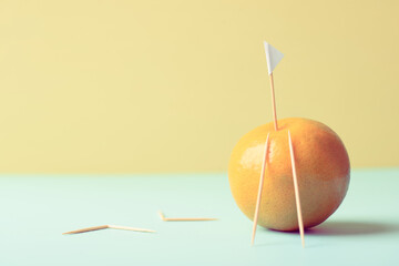 Business goal and success concept. Close up of orange stacking as step stair and flag on yellow and blue background. Copy space for text.