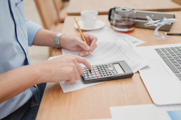 businessman using calculator for calculate budget accountancy, business data. finance and accounting concept
