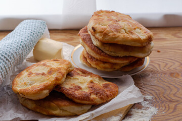 homemade cheese pies are on the kitchen table