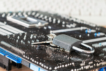 padlock with keys is located on the motherboard concept information protection