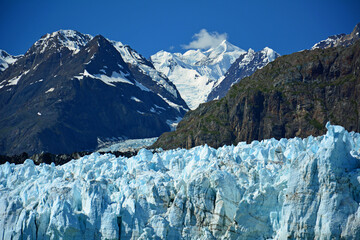 spectacular margerie glacier and surrounding mountain peaks of the fairweather range on a sunny...