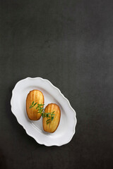 French madeleines on white plate