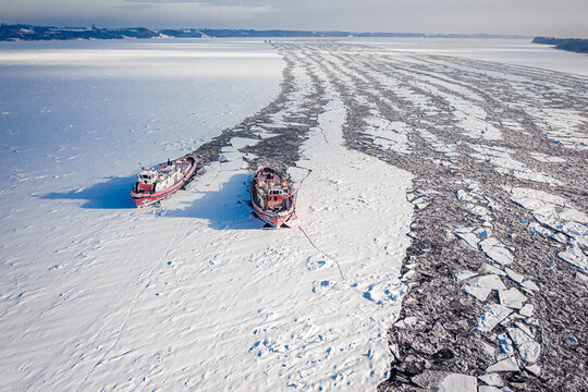 Icebreakers on Vistula River breking the ice, Poland