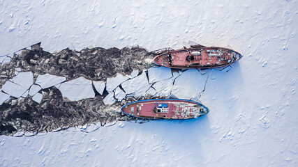 Icebreakers on Vistula river crushes the ice, Poland - obrazy, fototapety, plakaty
