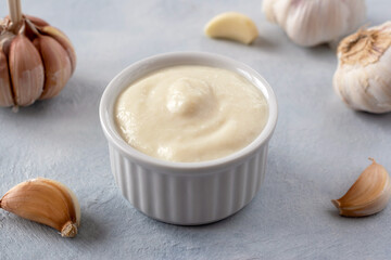 Lebanese Toum garlic sauce. All-purpose garlic sauce (no eggs) as an alternative to mayonnaise. It goes well with all dishes where garlic is appropriate. Selective focus.