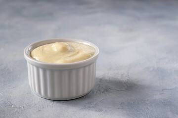 Lebanese Toum garlic sauce. All-purpose garlic sauce (no eggs) as an alternative to mayonnaise. It goes well with all dishes where garlic is appropriate. Selective focus.