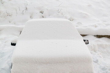 Car is covered with snow. Winter snow storm concept.