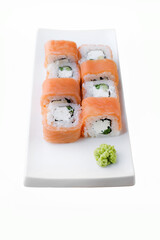 Japanese food restaurant delivery, sushi set . Sushi unagi, tempura rolls california with salmon, shrimp,  tuna, caviar and cheese isolated at white background. 