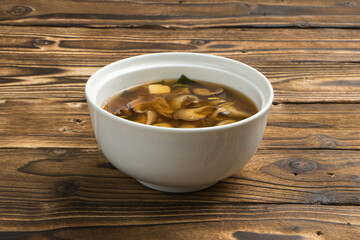Traditional Japanese soup with shiitake mushrooms, onion and tofu cheese