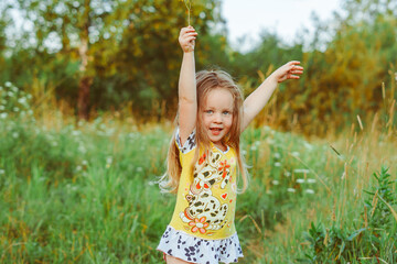 child in the garden on a Sunny day