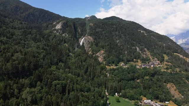 Green Forest And Waterfall On The Alpine Mountain In Morgex, Val D' Aosta, Italy. aerial