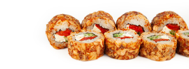 Sushi Roll with fried salmon in Teriyaki sauce on a white plate, ingredients Fried salmon, cream cheese, cucumber, baked pepper, flying fish roe, Spicy sauce, rice, nori. For the restaurant menu.