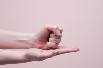 Female hands showing sign HELP. American sign language concept. Closeup, copy space
