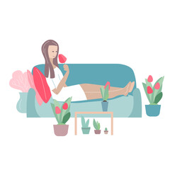 Woman relaxing at home around growing tulips.
