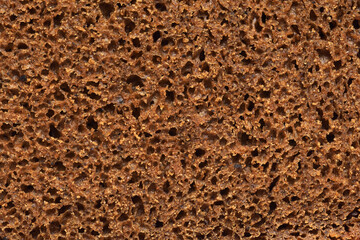 Inside part of sliced rye bread background or texture.