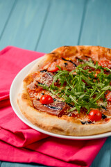 Christmas pizza on the wood board. Holiday celebration pizza. Italian cuisine concept.