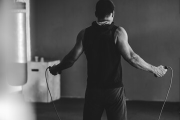 Fototapeta na wymiar Training in the gym with a skipping rope