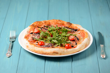 Christmas pizza on the wood board. Holiday celebration pizza. Italian cuisine concept.