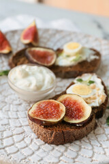 Tasty sandwich with fig on plate