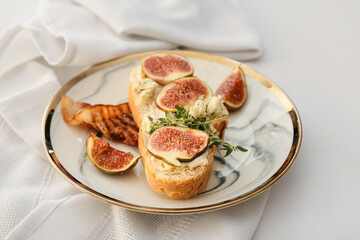 Tasty sandwich with fig on white background