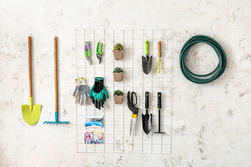 Set of gardening supplies and houseplants in barn