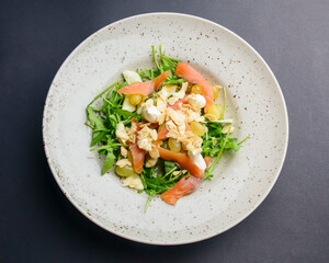 Salad - smoked salmon with vegetables and grapes. Delicious unique recipe, healthy salad for dinner.