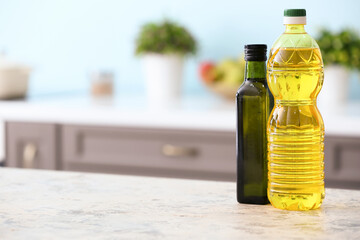 Bottles of oil on table in modern kitchen