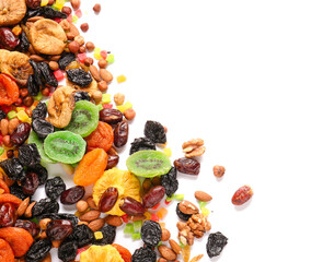 Different dried fruits and nuts on white background