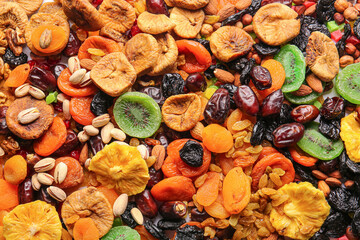 Different dried fruits and nuts as background