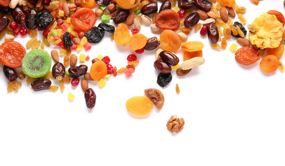Different dried fruits and nuts on white background