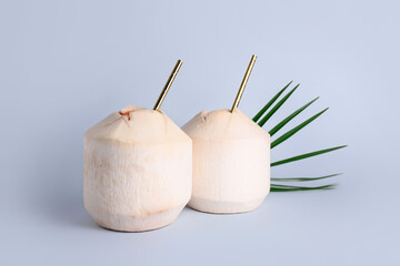 Fresh coconuts on light background