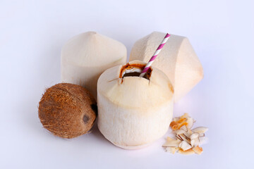 Fresh and ripe coconuts on white background