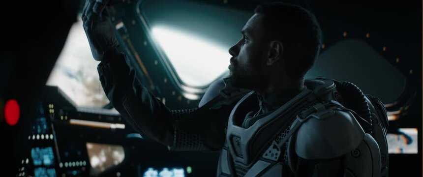CU Portrait of African American Black male astronaut inside spaceship cockpit. Sci-fi space exploration concept. Mars mission. Shot with 2x anamorphic lens