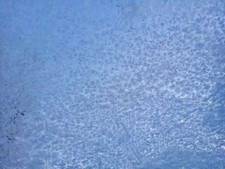 Fototapeta na wymiar Snow and ice on the glass of the car. 